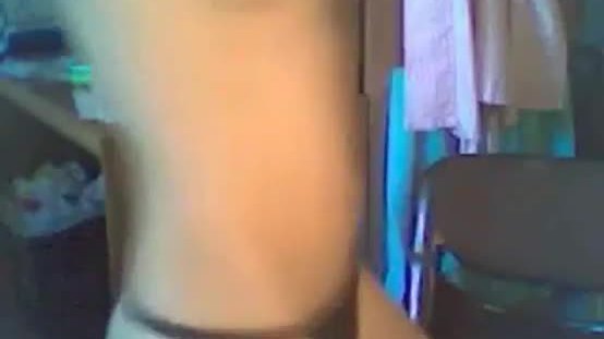 Cute brunette girl dances on webcam