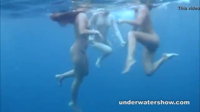 Young lesbos getting nude in swimming pool